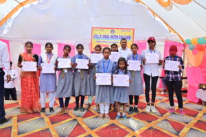 JYLD Ideal Inter College varshikotsav 2026 mein annual function mein participate karne wale vidyarthiyon ko participation certificate diya gaya manch par